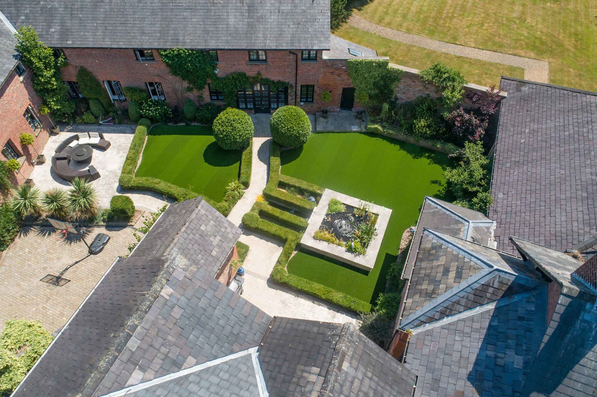 Zoomed out image of a garden with artificial grass