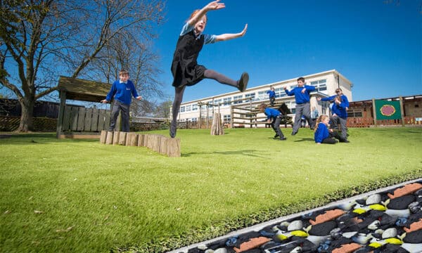 Children playing on the Lazy Pad 25mm shockpad