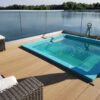 Millboard decking in Golden oak surrounding a swimming pool