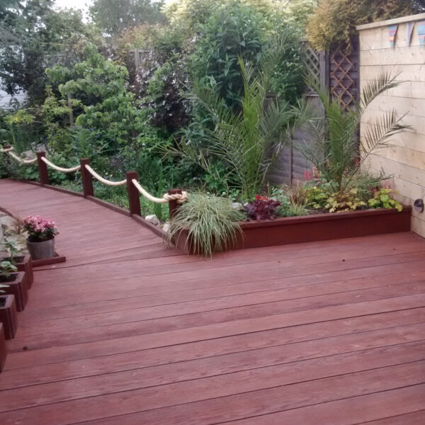 LazyLawn Millboard Decking in a Jarrah Garden