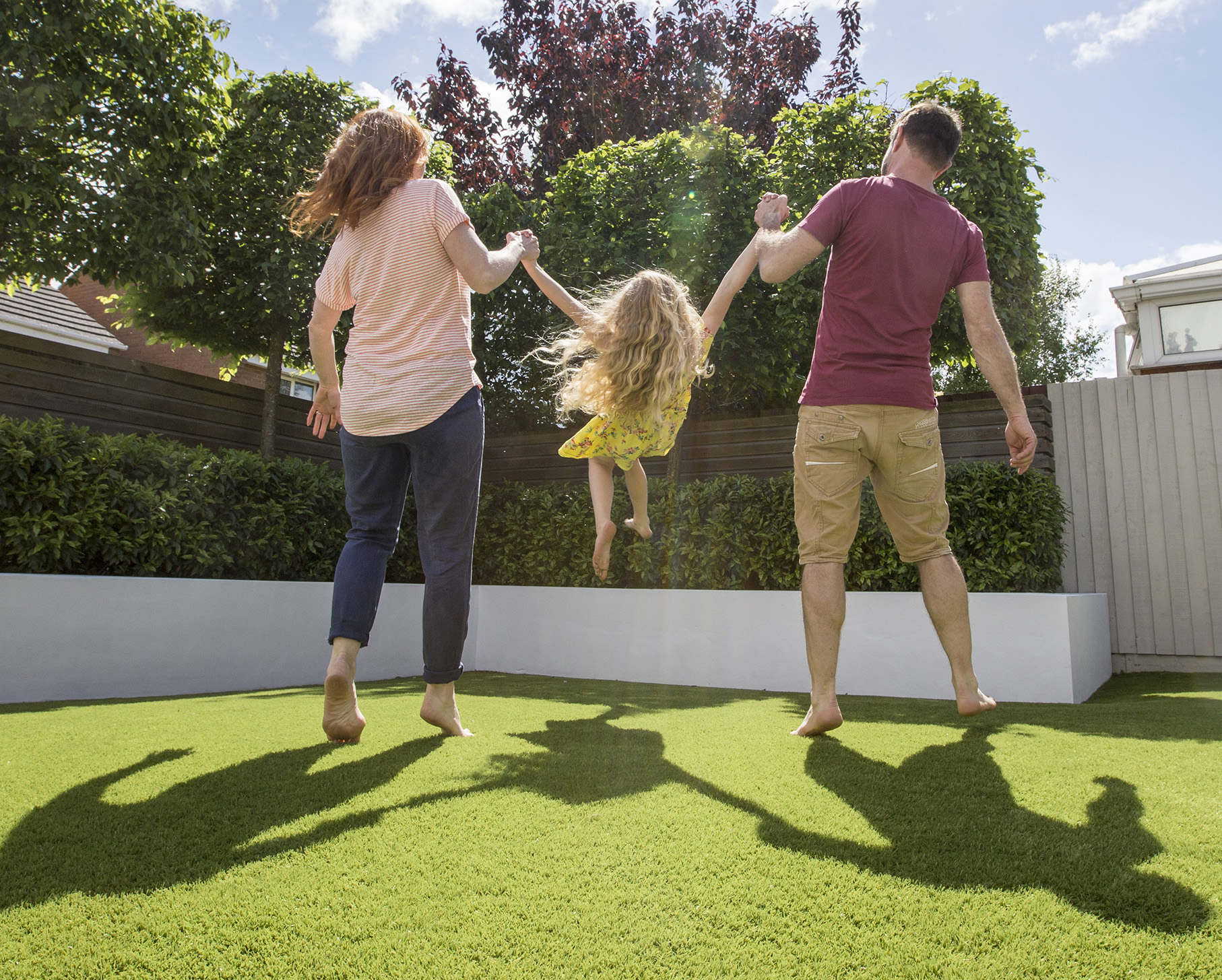 Family having fun on artificial grass