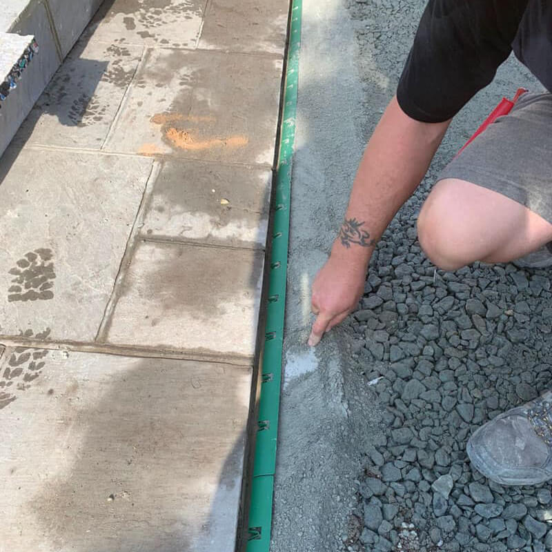 Granite being laid before installing Vertedge