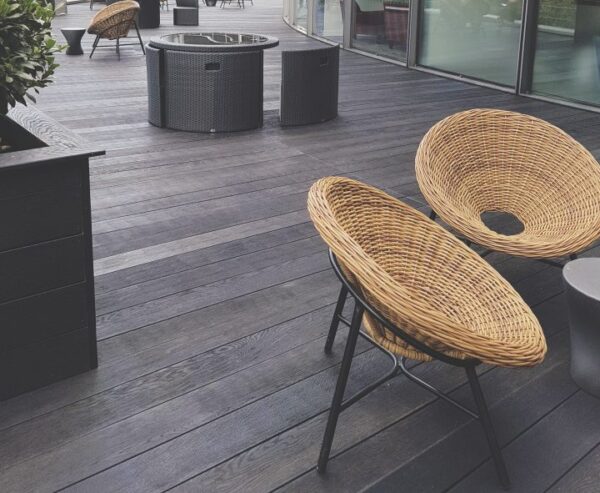 An image of millboard decking enhanced grain in burnt cedar