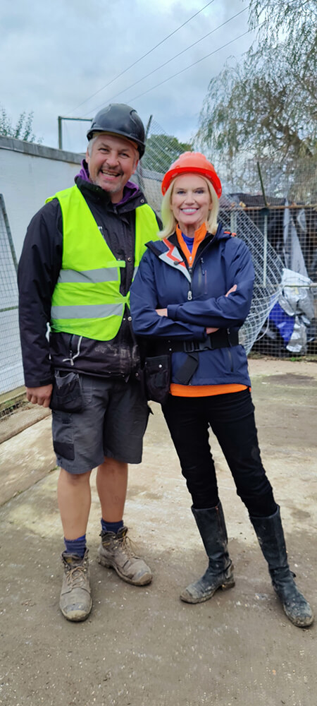 Picture of Anneka Rice with a LazyLawn staff member